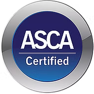 A circular, metallic-edged badge with a dark blue background displaying the white text