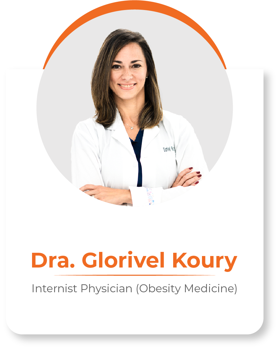 A woman in a white lab coat is standing with her arms crossed.