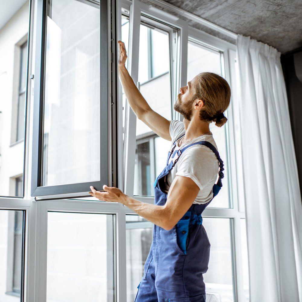 Man Installing Glass Window — El Sobrante, CA — Wadsworth Glass Inc.