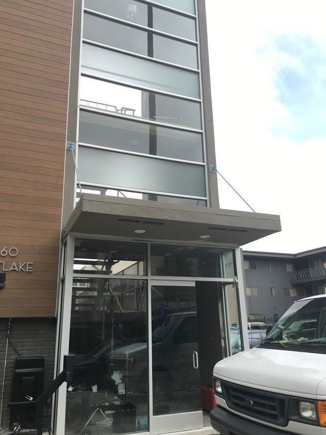 Building Entrance with Glass Windows Above — El Sobrante, CA — Wadsworth Glass Inc.