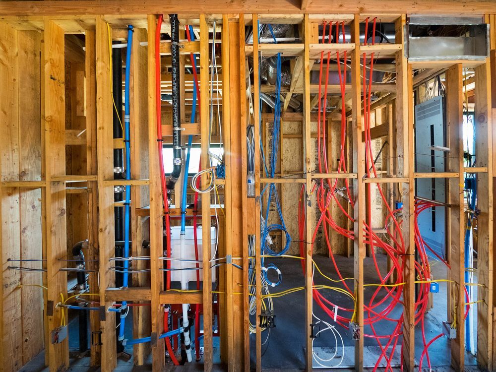 Wooden Wall Frame With Visible Plumbing and Electrical Wiring — CDT Electrical in Kingscliff, NSW