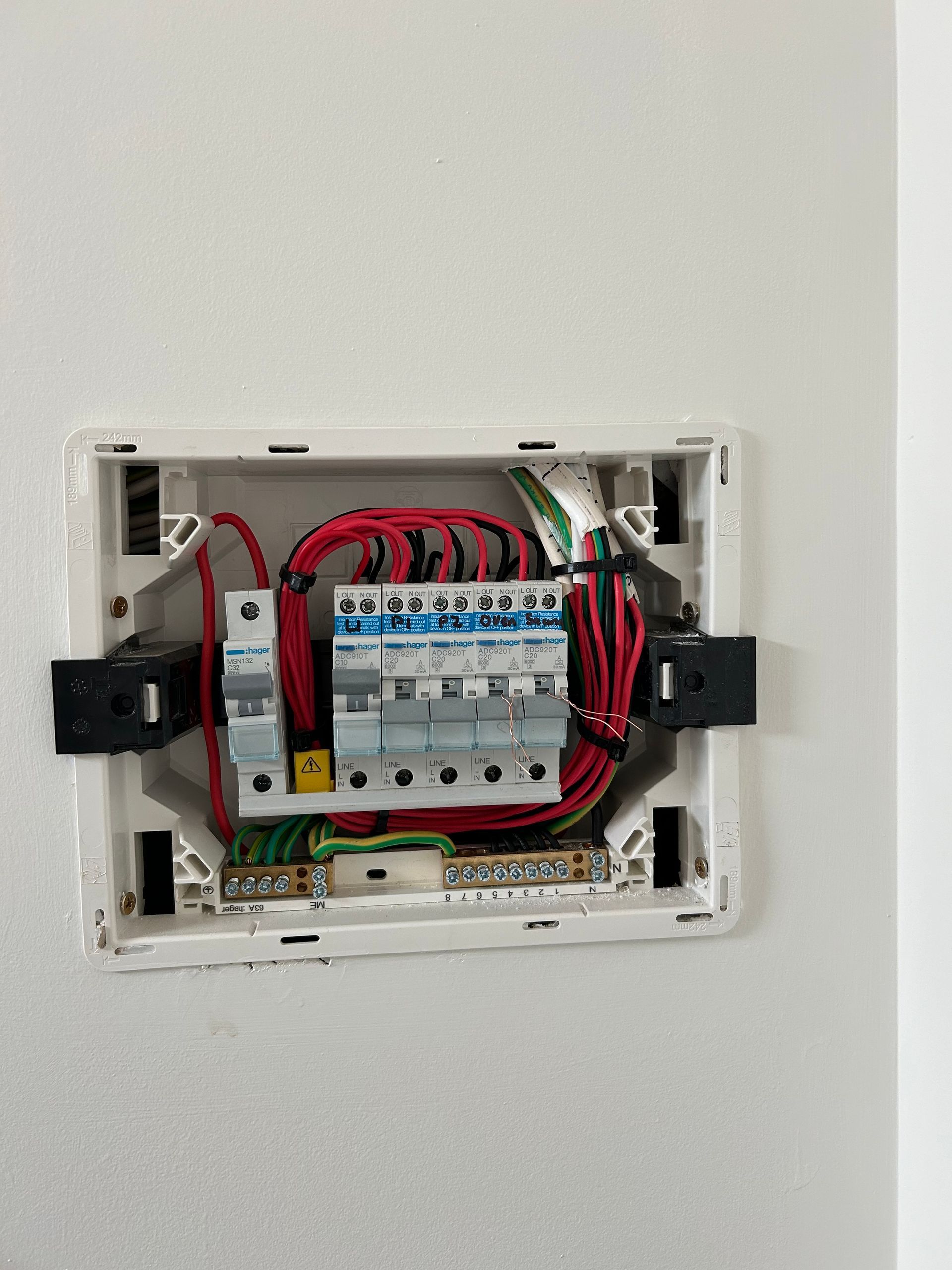 White Electrical Panel With Circuit Breakers and Wires — CDT Electrical in Kingscliff, NSW