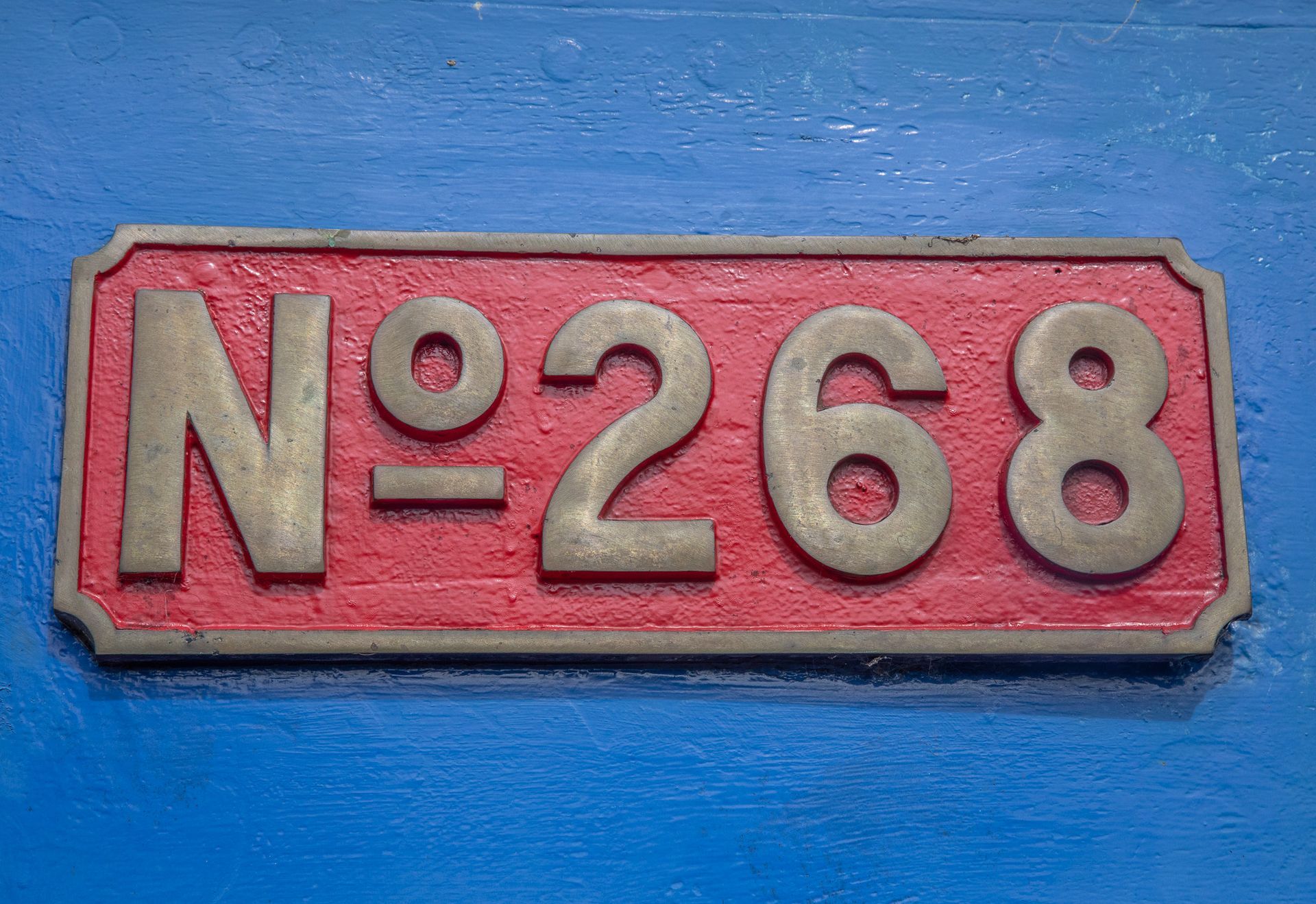 Red rectangular sign with the number 