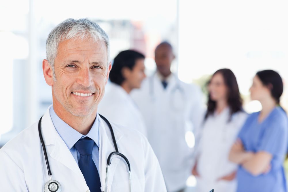 A doctor and his staff — Twin Peaks Finance In Helensvale, QLD