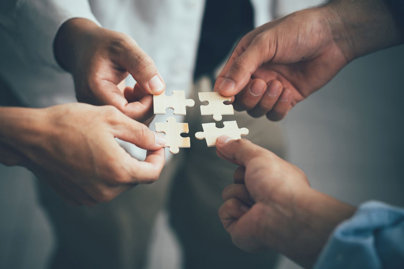 Hands putting puzzle pieces together— Twin Peaks Finance In Helensvale, QLD