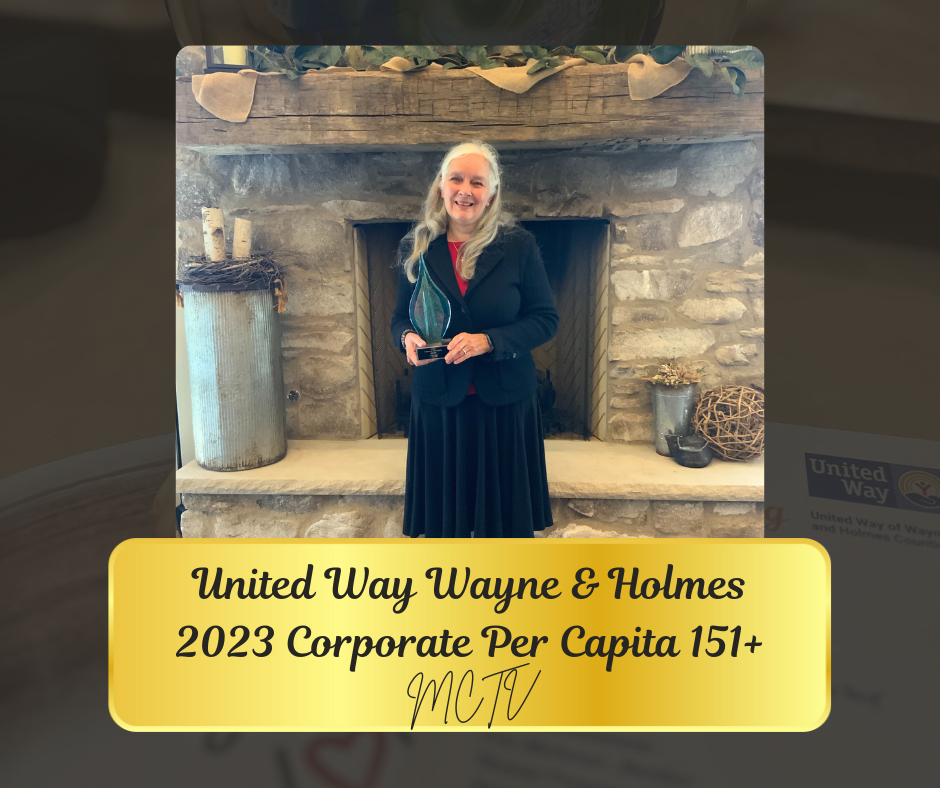 Woman in front of fireplace, United Way Wayne & Holmes 2023 award, gold border, MCTV logo.