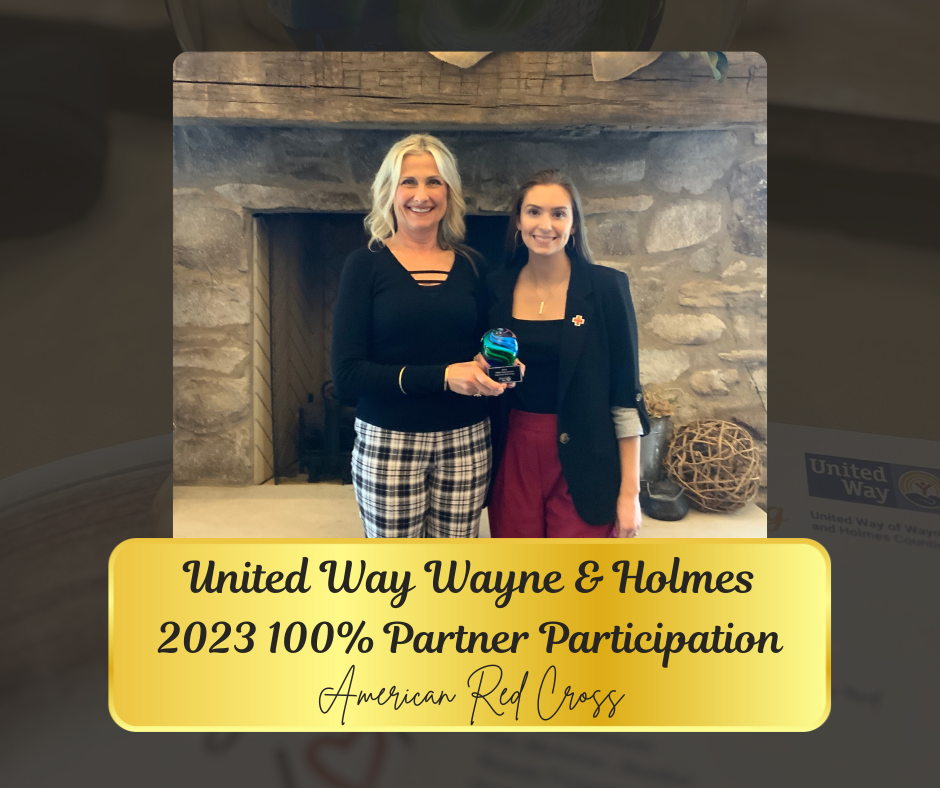 Two women in front of a fireplace, holding an award. Text: United Way Partner 2023. American Red Cross.