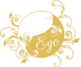 Logo for Alter Ego Hair Studio, a salon. Gold circle, pink text, decorative flourishes.