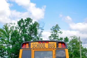 Yellow school bus rear with 