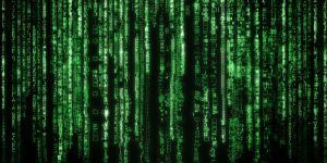 Green digital code cascading down on a black background.