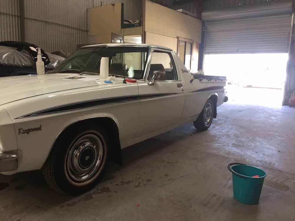 White Vintage Car Inside the Shed — All Port Smash Repairs in Port Macquarie, NSW