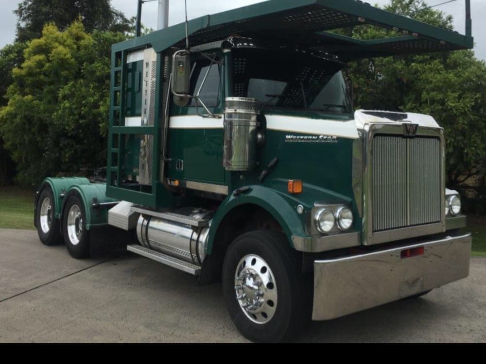 A Green Semi Truck Is Parked On The Side Of The Road — All Port Smash Repairs in Port Macquarie, NSW