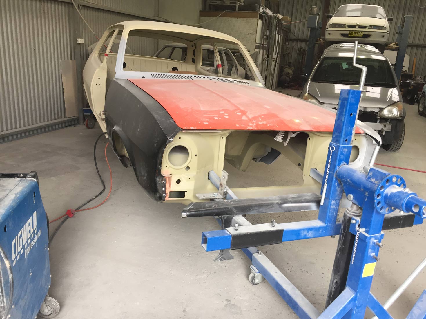 A Car Is Sitting On A Stand In A Garage — All Port Smash Repairs in Port Macquarie, NSW