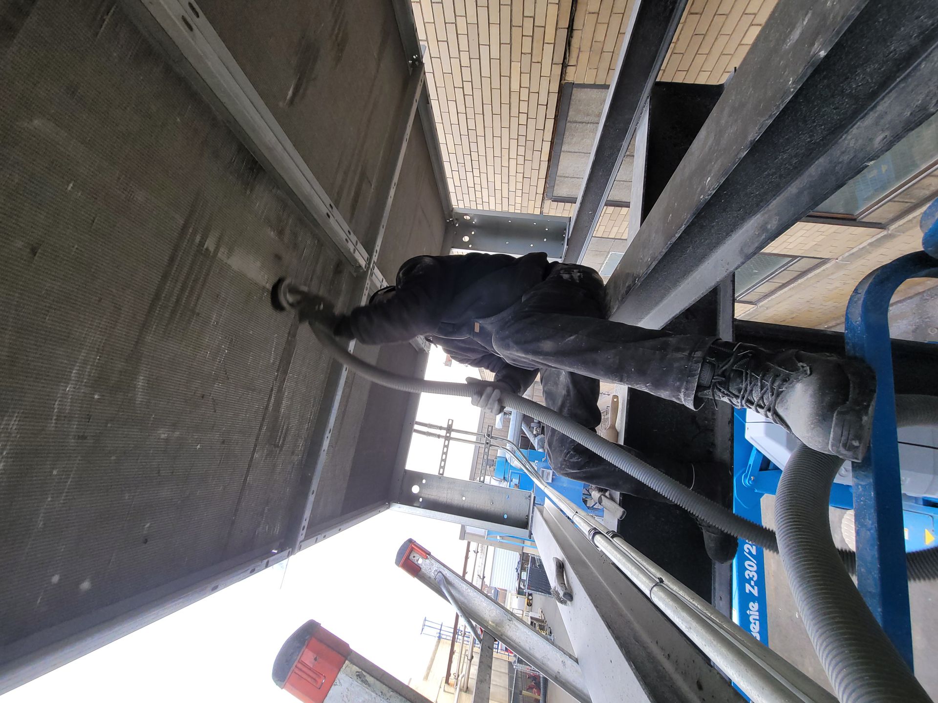 Man Cleaning Air System — Springfield, MA — Advanced Air Quality, Inc.