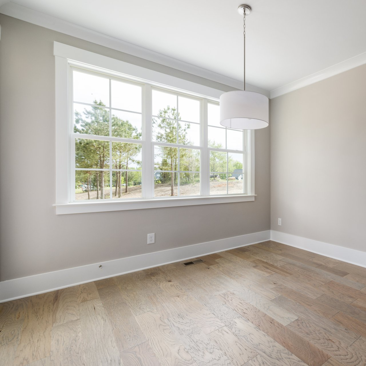 Photo of a room with windows.