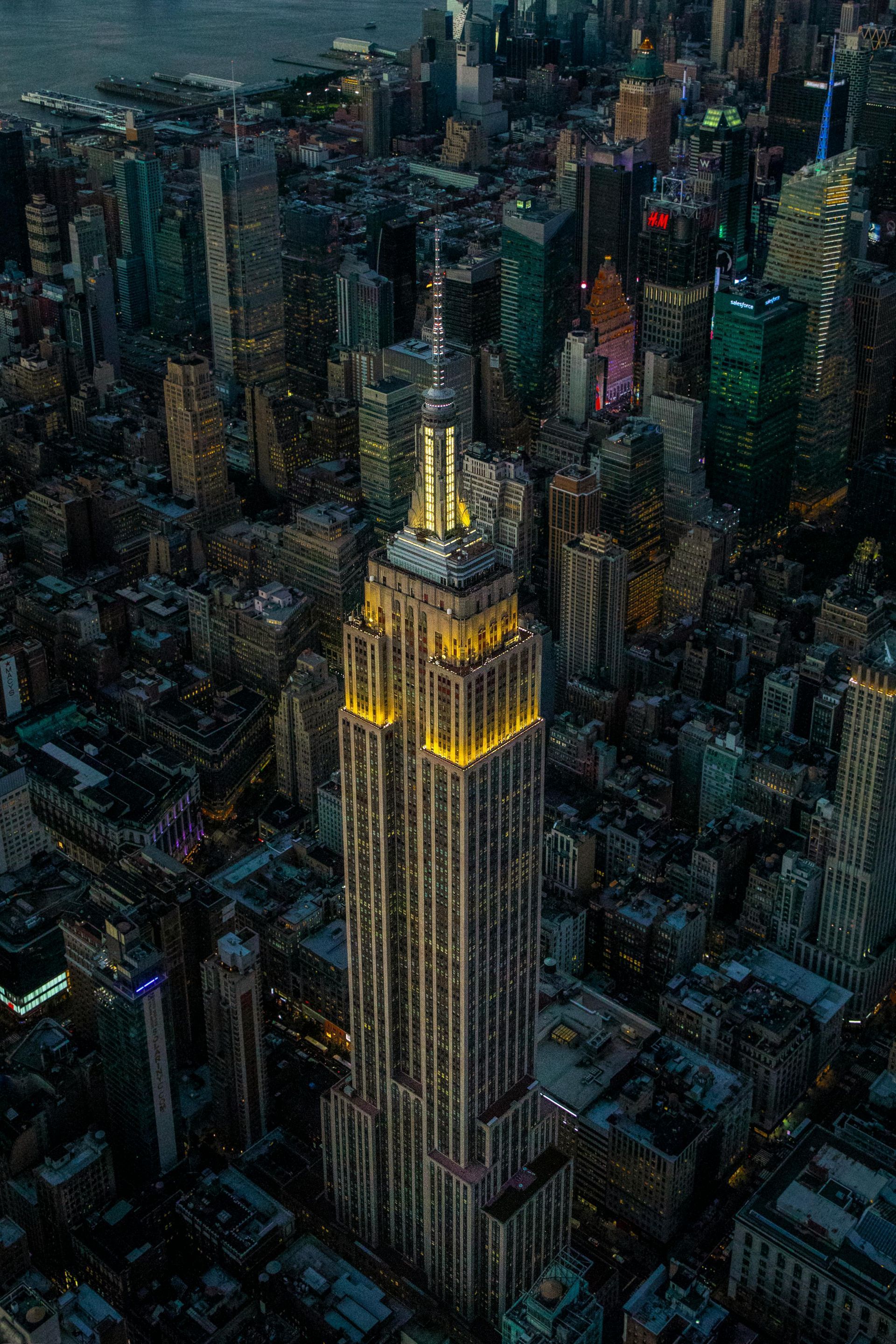 An aerial view of the empire state building in new york city at night.