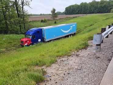VJ's Towing & Rescue performing a heavy-duty winch out for a semi truck in a ditch near Perrysburg, OH. Address: 26725 Eckel Rd, Perrysburg, OH 43551. Call (419) 874-3251 for recovery services.