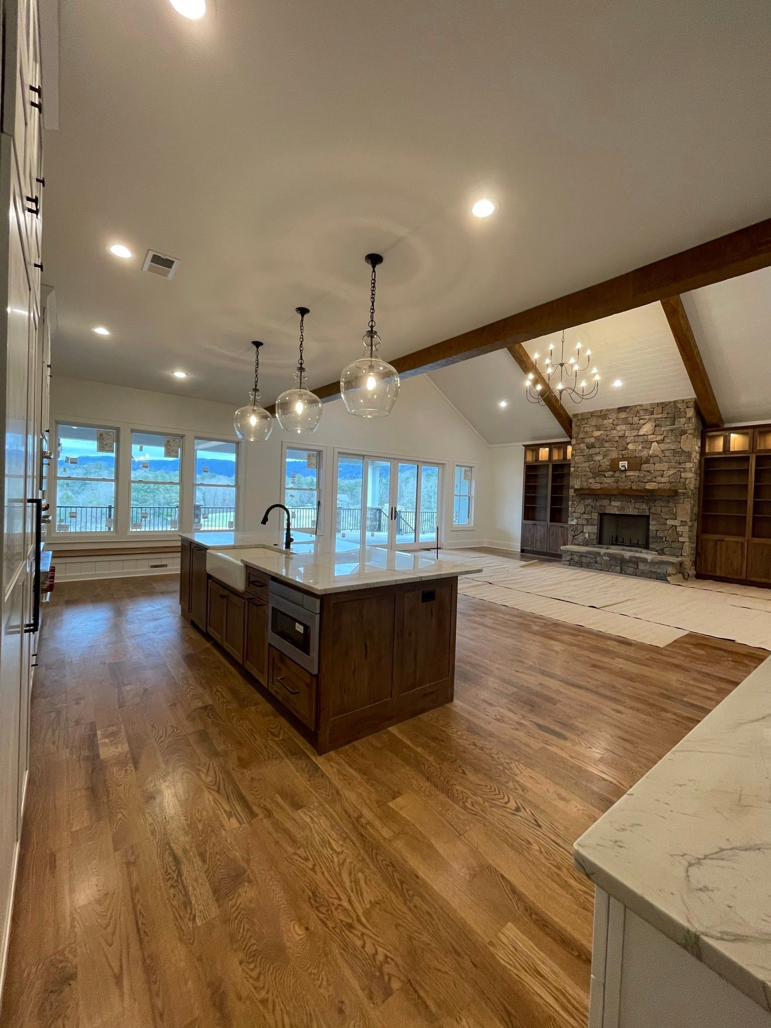 A kitchen with a large island in the middle of the room.