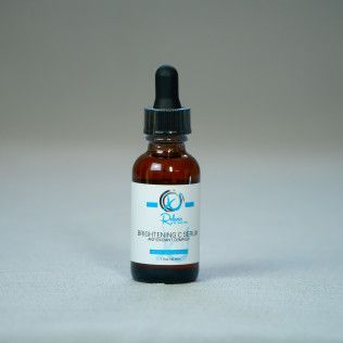 Bottle of Skin Care Pro Brightening C Serum with a dropper.