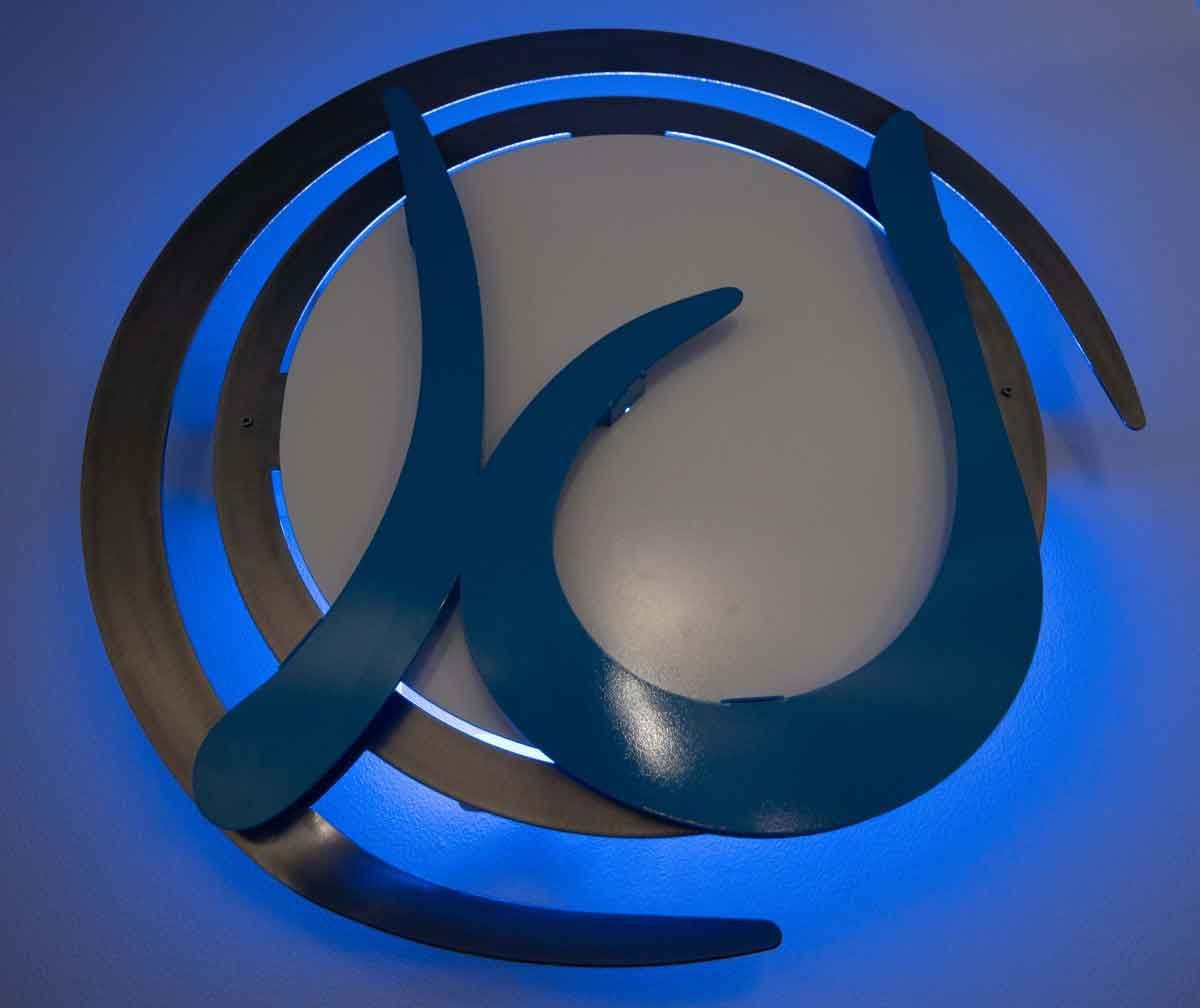 Blue and silver metal logo with