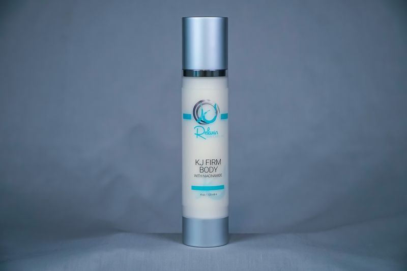White tube of lash serum on a fluffy, white surface;