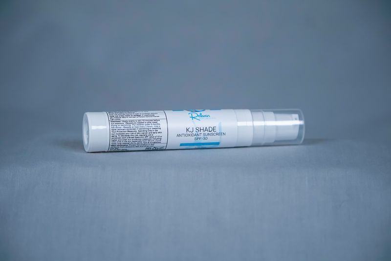 White skincare bottle labeled