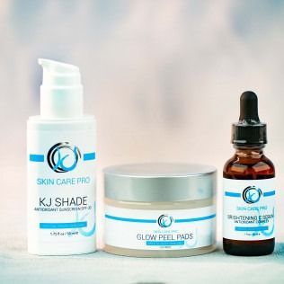 Three skincare products: lotion with pump, jar, and dropper bottle. Blue and white labels.