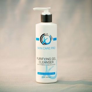 White bottle of Skin Care Pro purifying gel cleanser with a pump dispenser.