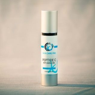 Skin Care Pro Peptide C anti-aging gel bottle, white with blue text on a light background.