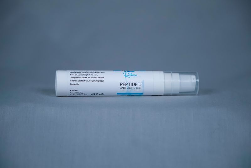 Skin Care Pro Peptide C anti-aging gel bottle. White, blue, and silver.