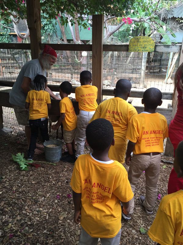 A group of children wearing yellow shirts that say change