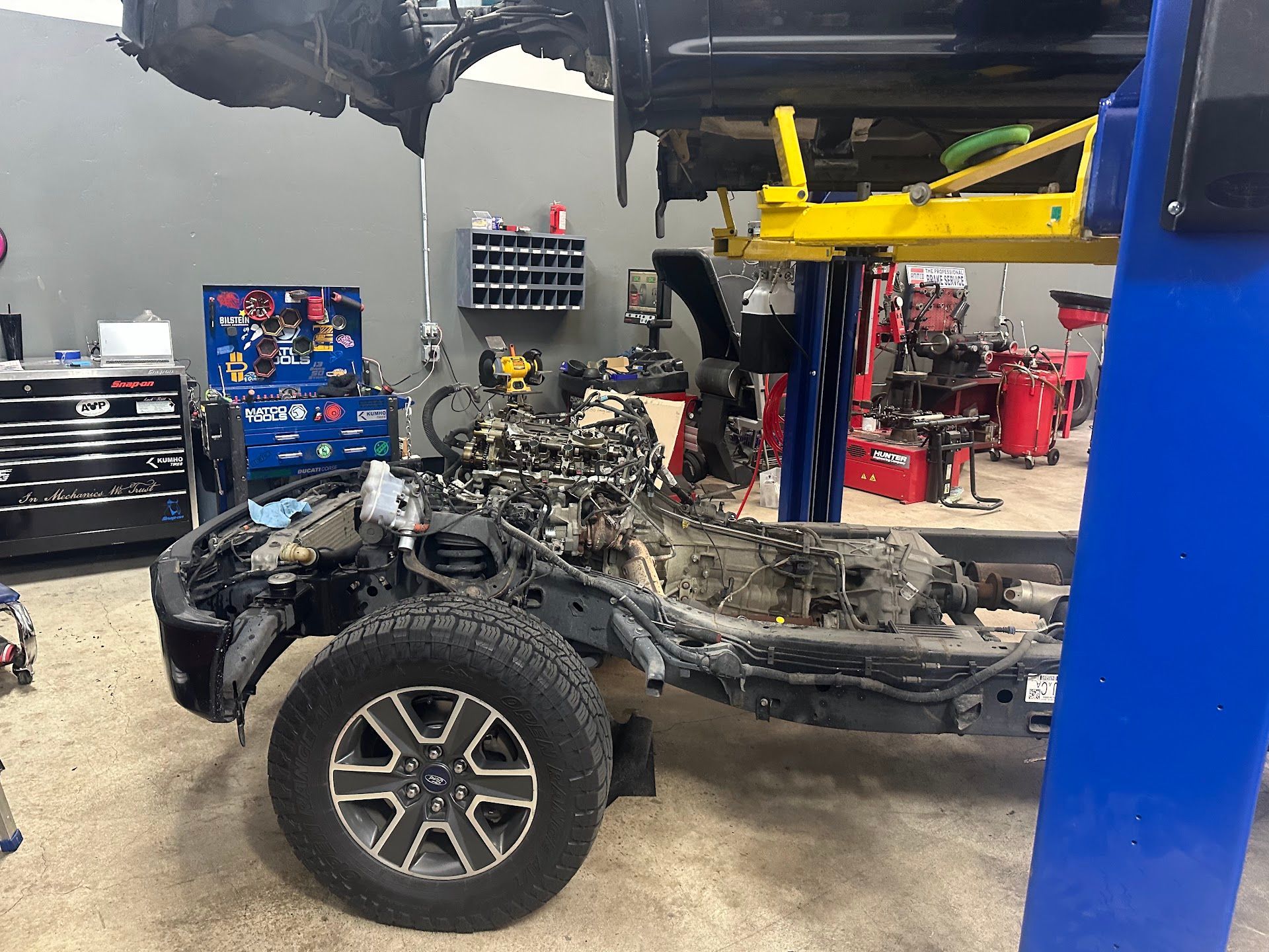 Vehicle Frame Disassembled On Lift During Engine Service | Immaculate Auto Repair & Service