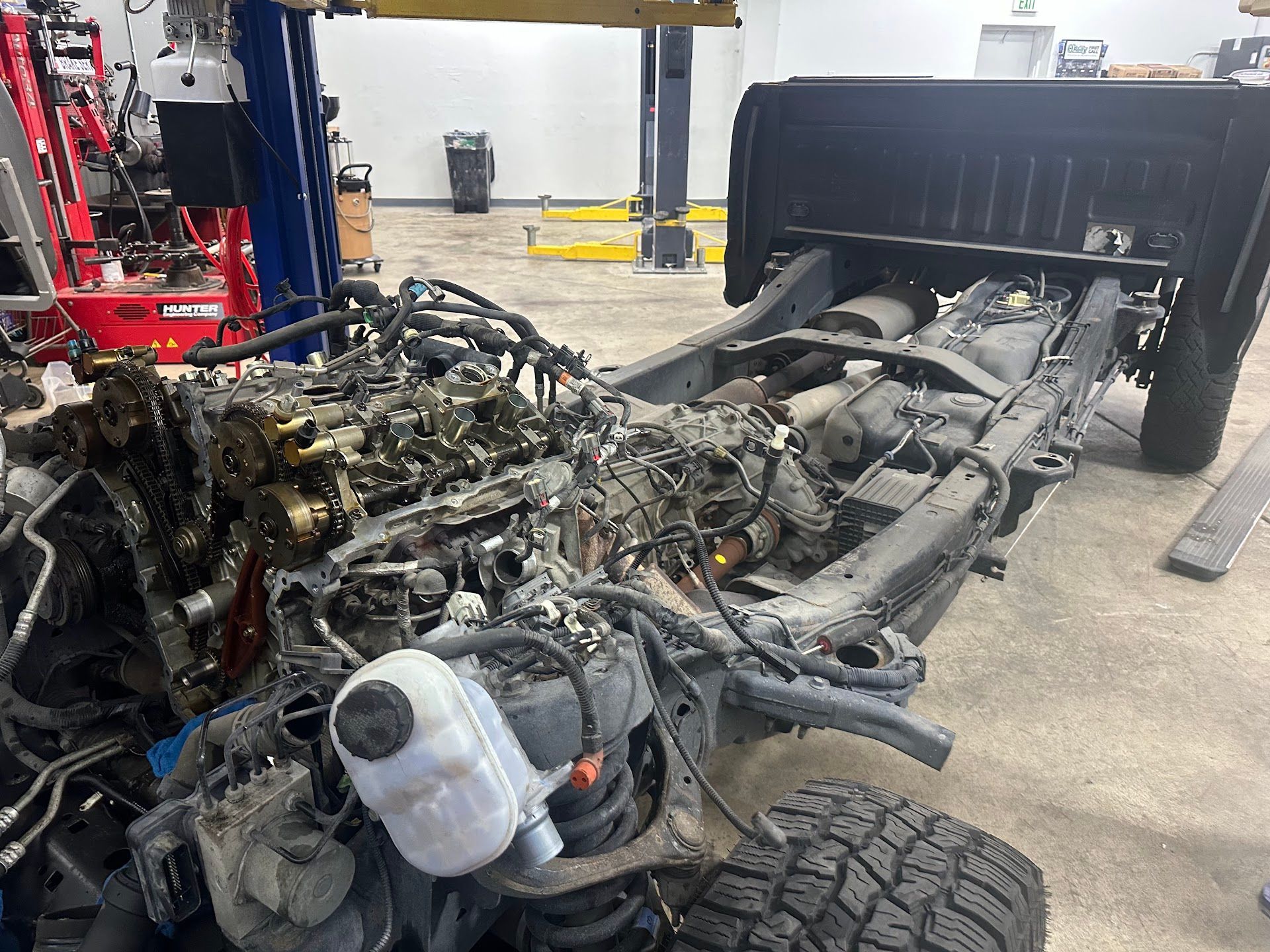 Truck Frame And Engine Under Repair Inside Auto Shop | Immaculate Auto Repair & Service