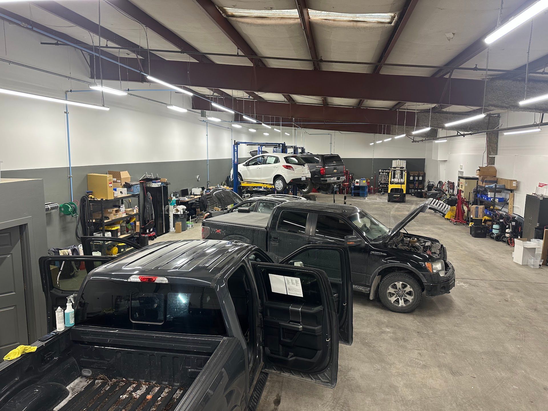 Interior View Of Garage Showing Vehicles Undergoing Repairs | Immaculate Auto Repair & Service