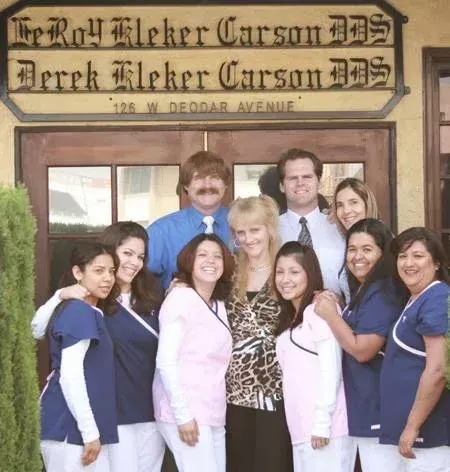 Group of staff and students posing outside Dereck Fleker Carson DDS office