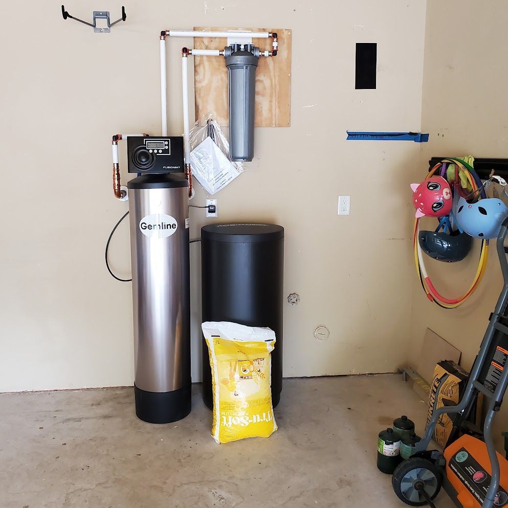 A bag of dog food sits next to a water softener