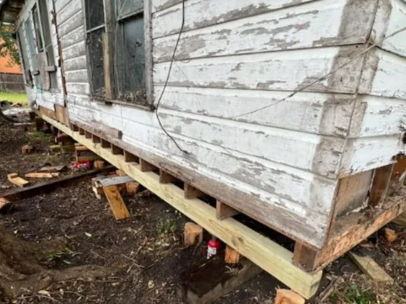 An image showing foundation repair work in progress by Texas Foundation Repair, one of the foundation repair companies in San Antonio.