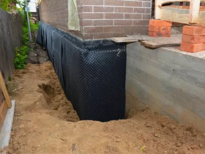 An image showing house leveling services in progress, fixing foundation walls.