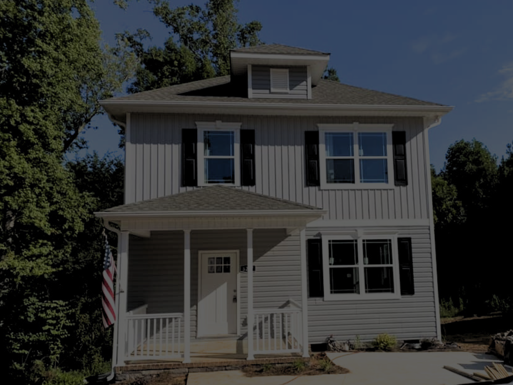 Two story house with American Flag