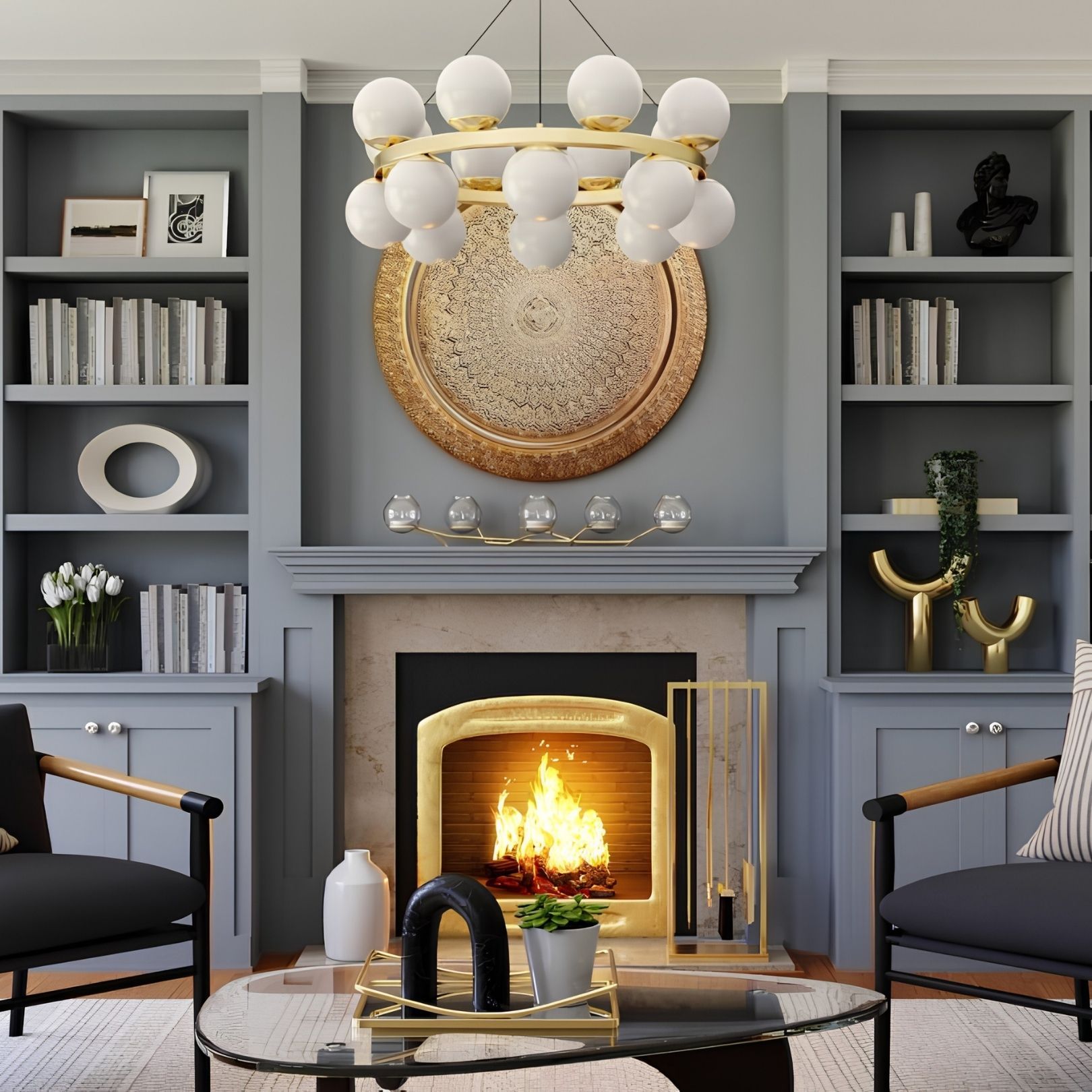 Elegant gray living room with a lit fireplace, gold chandelier, built-in shelves, and two black chairs