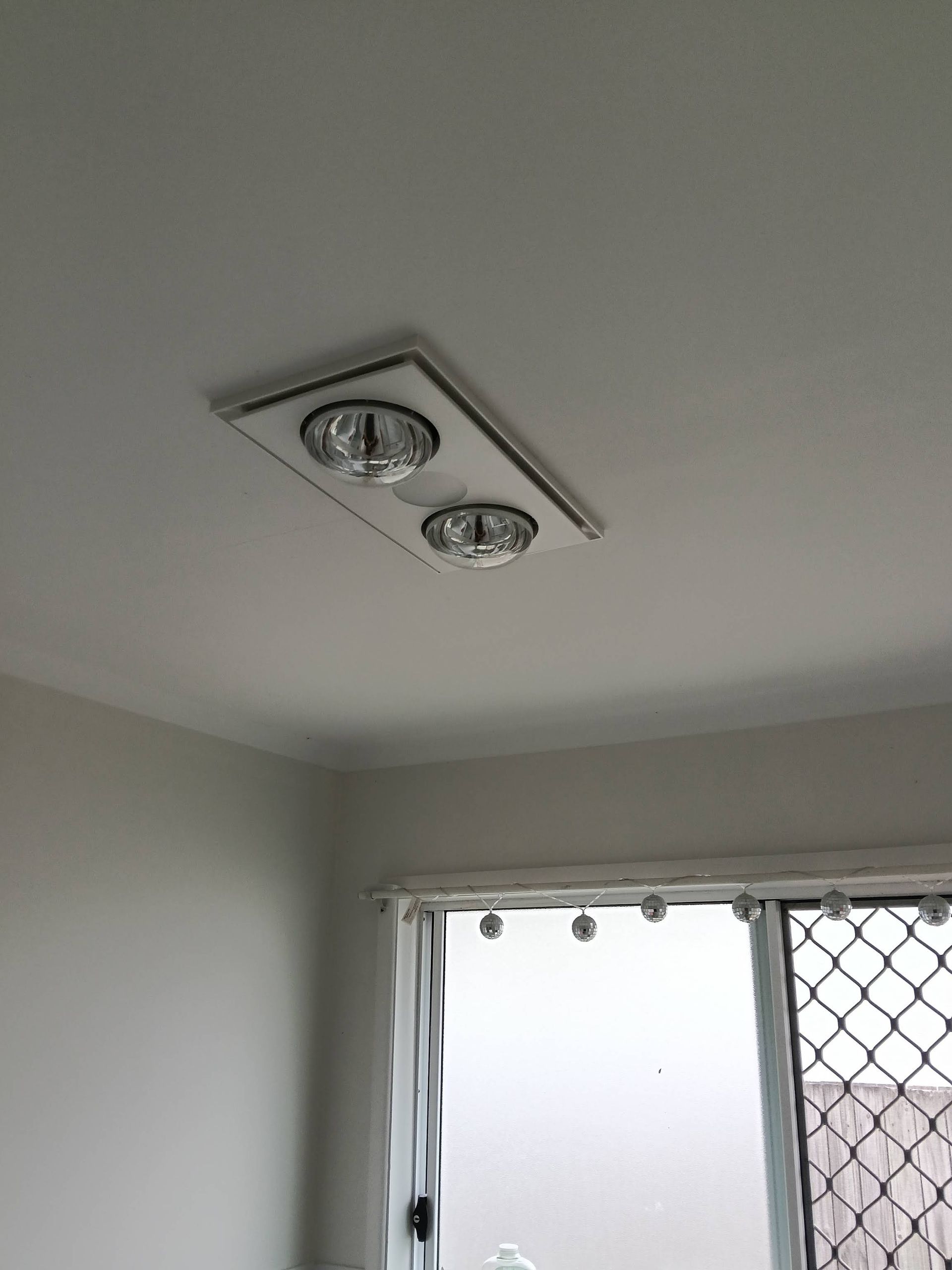 Ceiling Light Fixture With Two Recessed Lights Above a Window — DC Active Electrical in Brighton, QLD