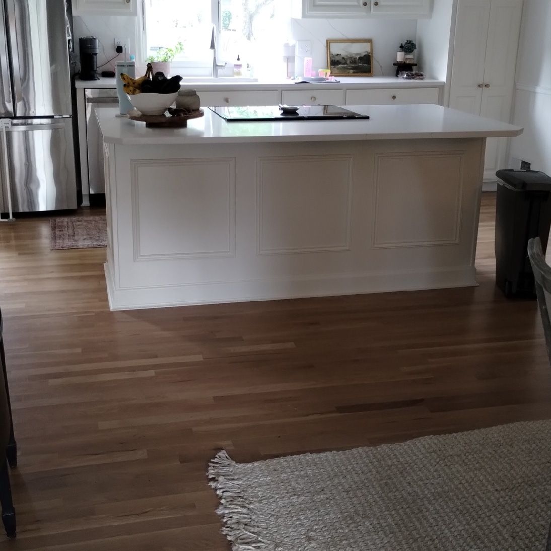 There is a large island in the middle of the kitchen.