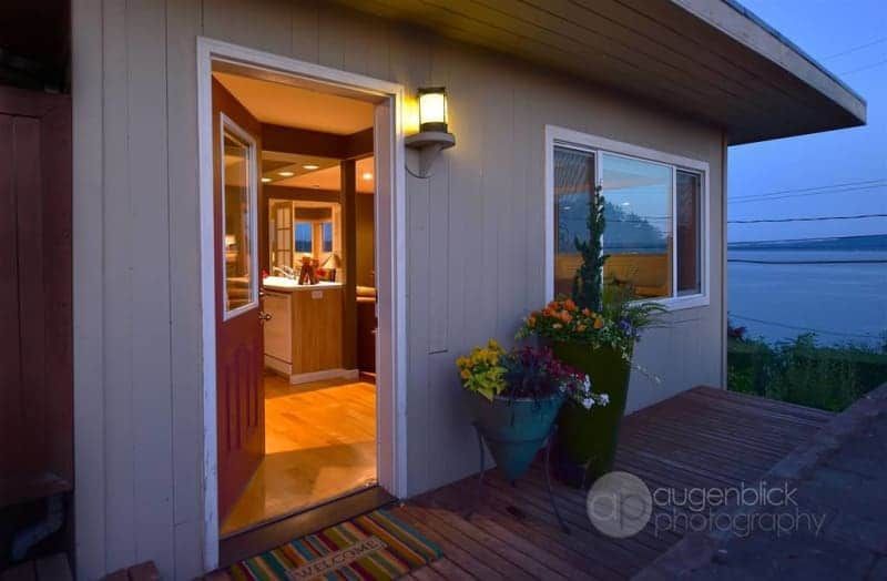 The front door of a house with a view of the ocean.