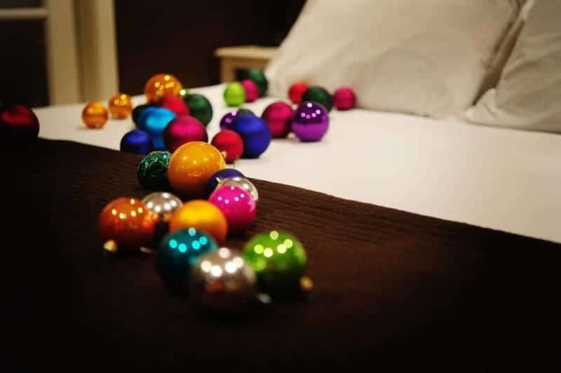 A bed with a bunch of christmas ornaments on it