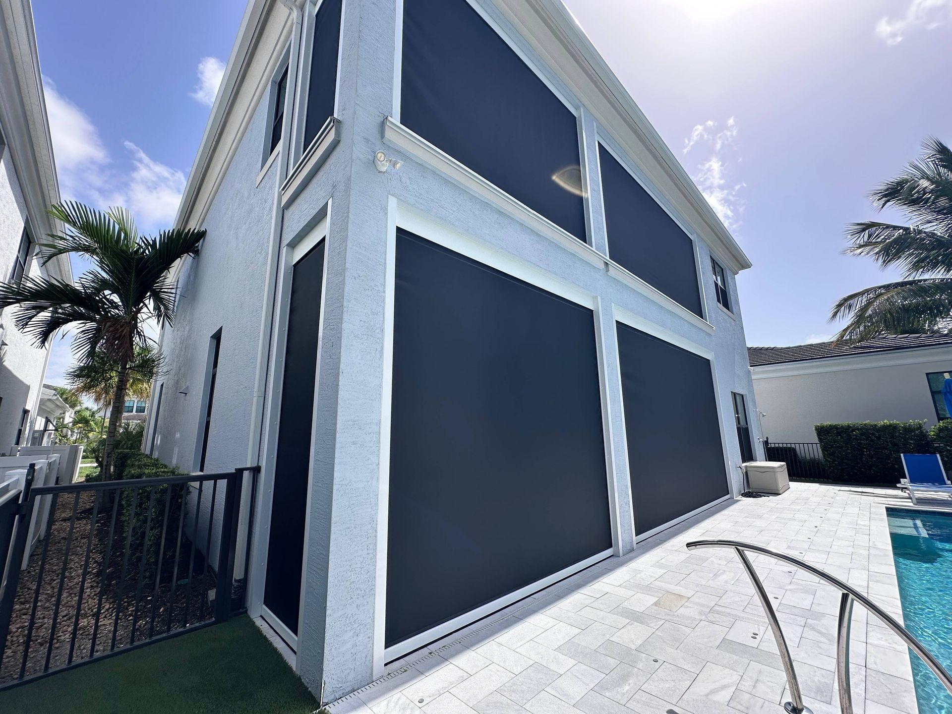 MagnaTrack™  Defender Hurricane Screen Shades on a home's patio near Ft. Lauderdale, Florida (FL)