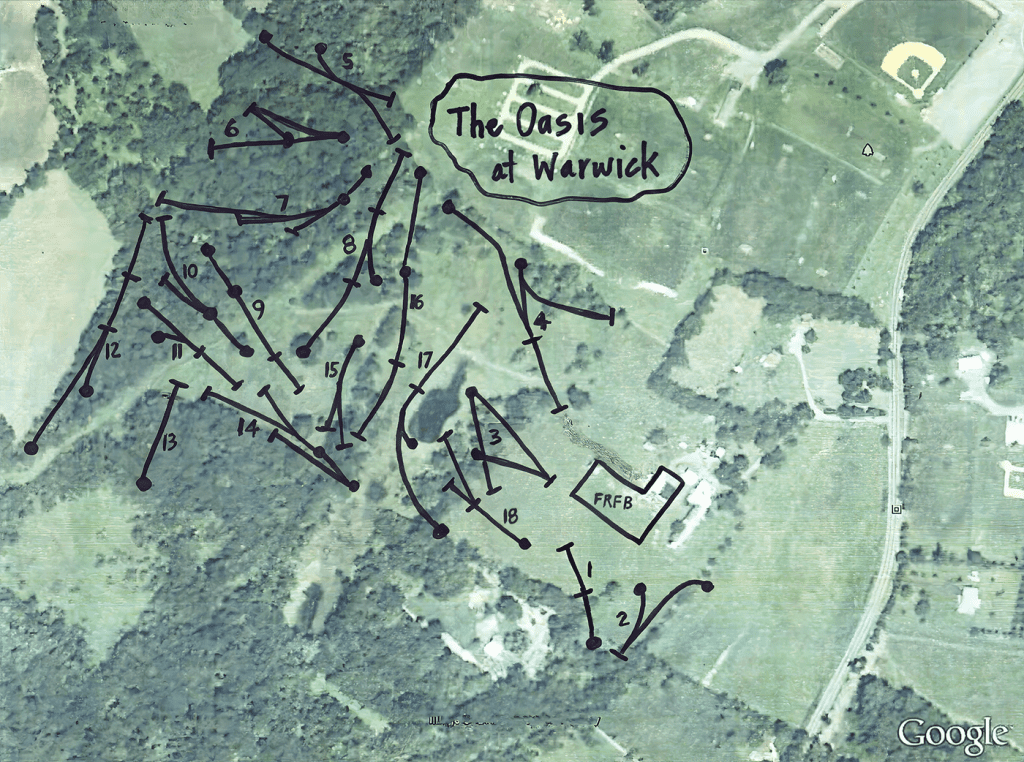 Aerial view of a rural landscape with hand-drawn arrows and labels marking The Oasis of Warwick.