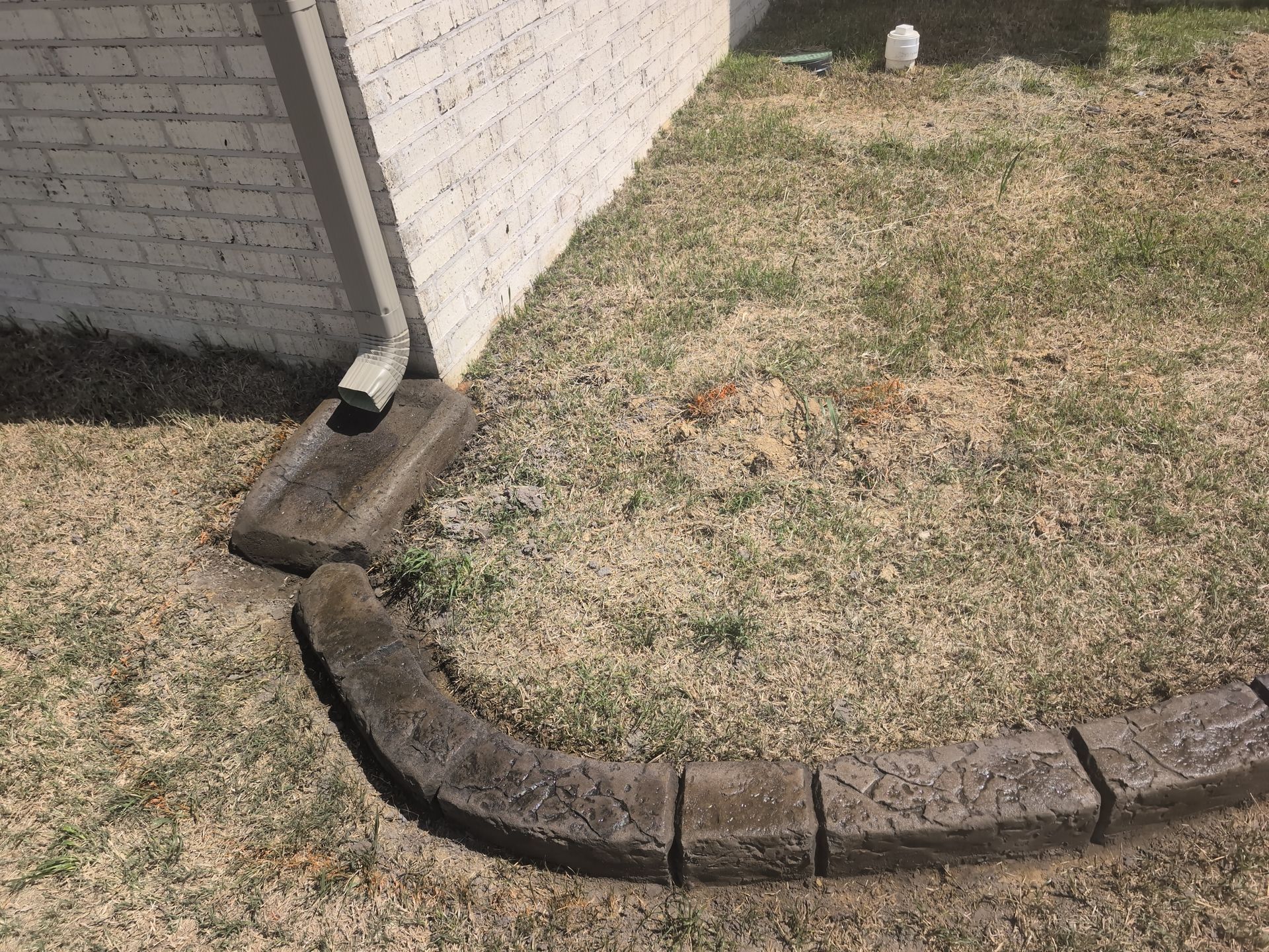 Gutter Splash Pad Moroccan Natural Stone Custom Stamped Edging Landscaping Garden Bed Home Residential The Curb Guy Marcus MrCurber Arkansas