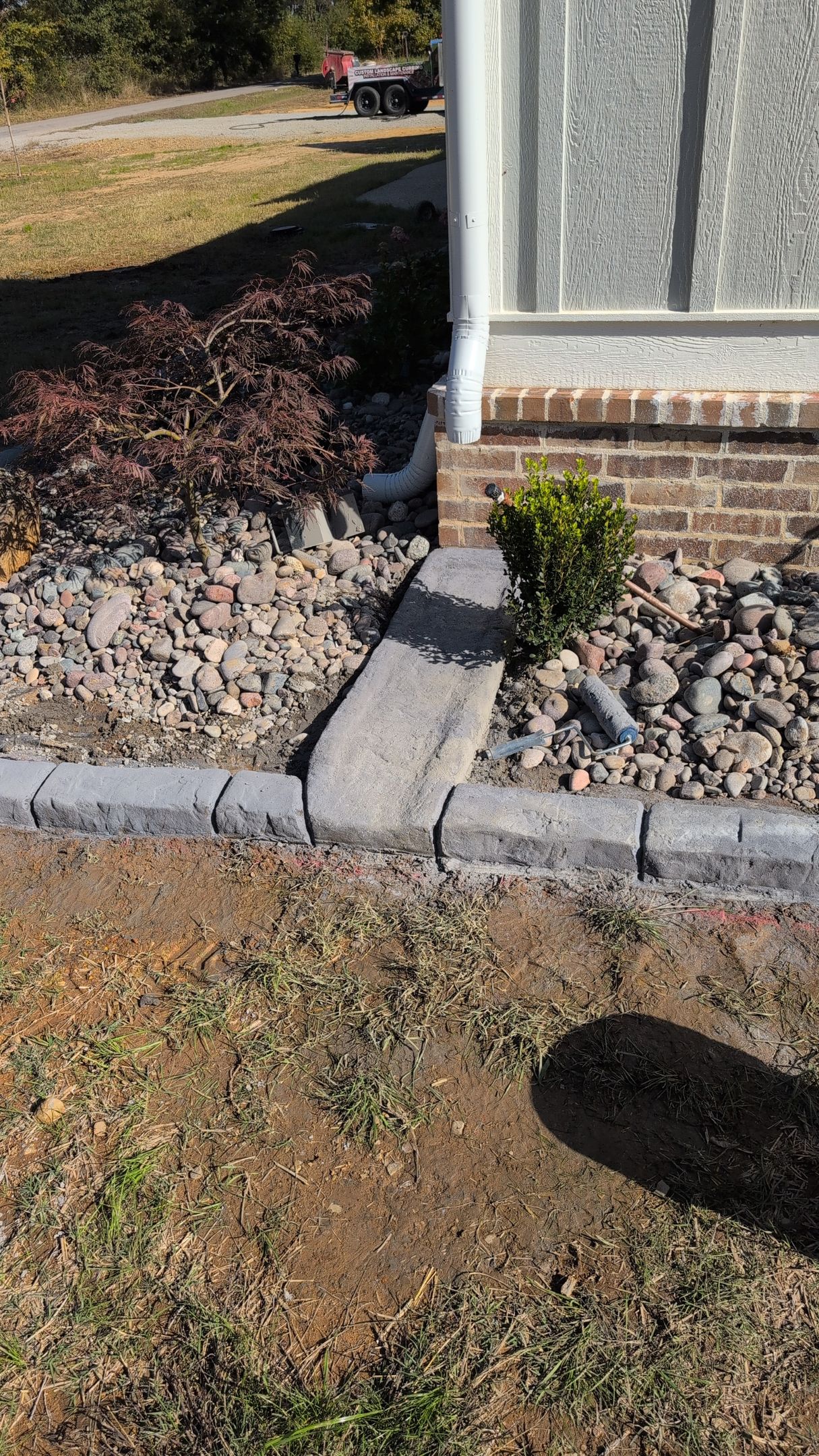 Gutter Splash Pad Moroccan Natural Stone Custom Stamped Edging Landscaping Garden Bed Home Residential The Curb Guy Marcus MrCurber Arkansas