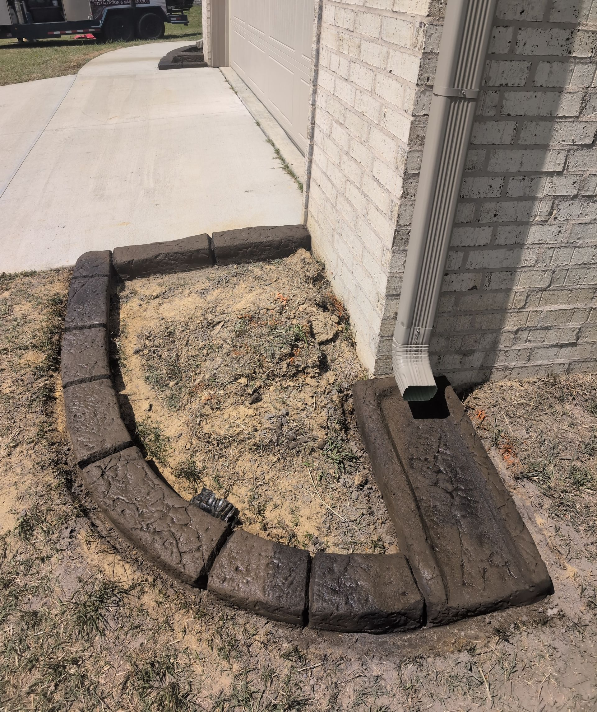 Gutter Splash Pad Moroccan Natural Stone Custom Stamped Edging Landscaping Garden Bed Home Residential The Curb Guy Marcus MrCurber Arkansas