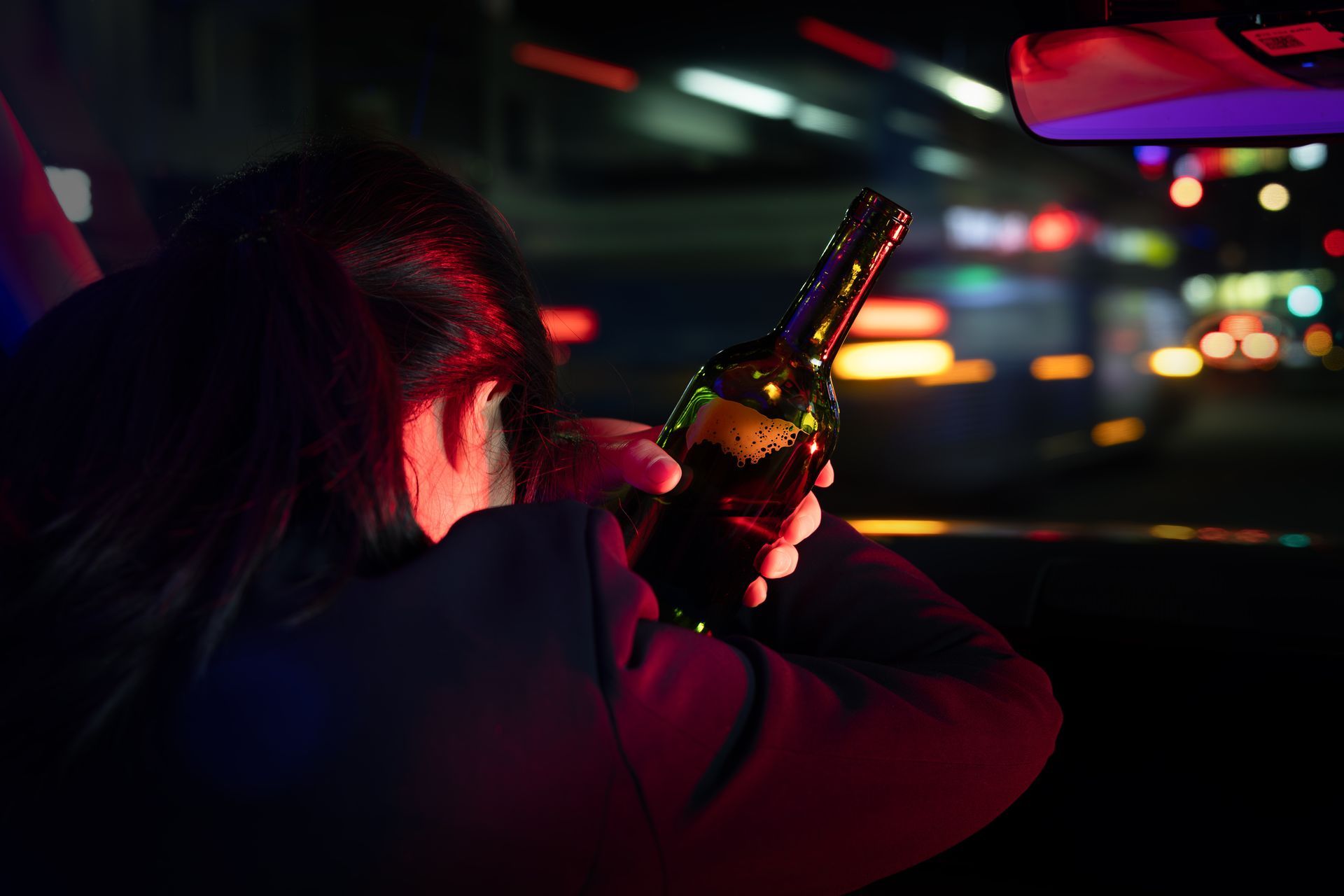 person handcuffed by wrecked car